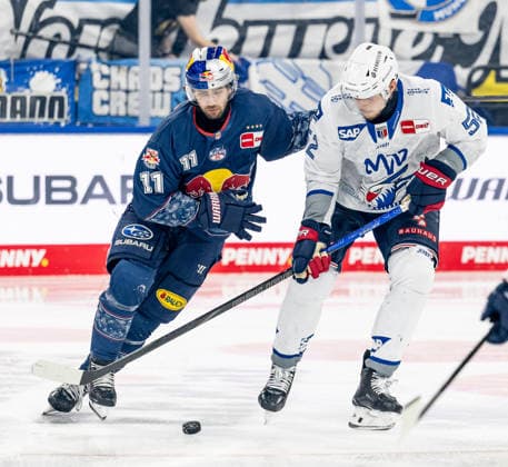 Fight for the puck duel between Markus Eisenschmid EHC Red Bull Muenchen, 11 and Nicolas Mattinen Adler Mannheim, 52 GER, EHC Red Bull Muenchen vs Adler Mannheim, ice hockey, DEL, playoffs, semi-final game 4, season 2025 2026, 14 04 2026 GER, EHC Red Bull Muenchen vs Adler Mannheim, ice hockey, DEL, playoffs, semi-final game 4, season 2025 2026, 14 04 2026 Muenchen Copyright: xEibner-Pressefoto HeikexFeinerx EP_HFR