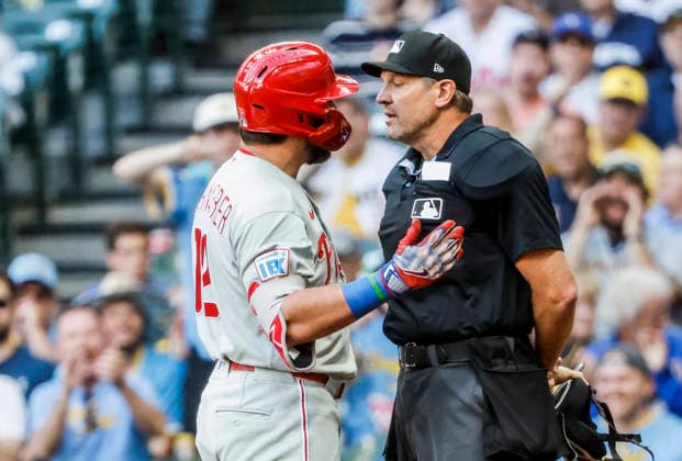Philadelphia Phillies designated hitter Kyle Schwarber argues with home plate umpire Chad Fairchild after being called out on strikes in the first inning of the MLB, Baseball Herren, USA game between the Philadelphia Phillies and the Milwaukee Brewers at American Family Field in Milwaukee, Wisconsin on Friday, June 12, 2026. MIL20260612807 TANNENxMAURY