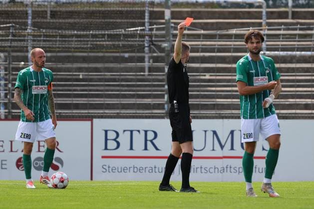 August 26, 2026, GER, Regionalliga Nord, Soccer, Matchday 1, 2026–2027 Season, Dietmar Scholze Stadium at the Lohmuehle, VfB Lübeck vs. SC Weiche Flensburg Red Card Referee Kevin Behrens shows Maximilian Schütt (VfB Lübeck, No. 23) a red card; on the left, Marvin Thiel (VfB Lübeck, No. 13). Photo: nordphoto GmbH, Tauchnitz, Lübeck. Dietmar Scholze Stadium an der Lohmuehle, SH, Germany Copyright: xnordphotoxGmbHx xTauchnitzx