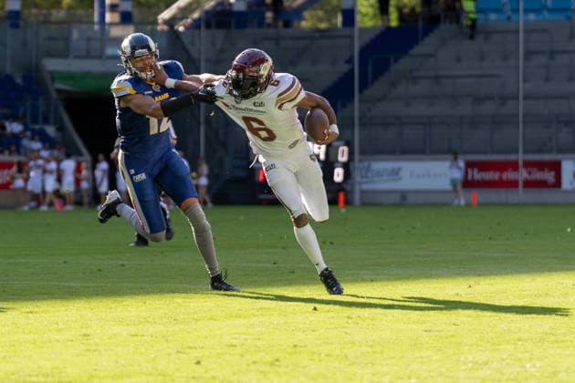 Matheo Diarra of the Alpine Rams (12) tries to stop Kaylon Geiger of the Rhein Fire (06), GER Rhein Fire vs. Alpine Rams, American Football, AFLE, 2026 Season, August 1, 2026, GER Rhein Fire vs. Alpine Rams, American Football, AFLE, 2026 Season, August 1, 2026, Duisburg Copyright: xEibner-Pressefoto FabianxFriesex EP_FFE