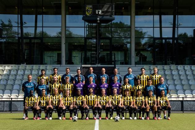 ARNHEM , 04-08-2026 , Nationaal Sportcentrum Papendal , season 2026 2027 , Dutch Keuken Kampioen Divisie football , Photocall , picture shows Vitesse squad with, back row L-R, Vitesse player Ayman Sellouf, Vitesse player Omar Achouitar, Vitesse performance coach Lars Smeenk, Vitesse assistant coach Timm Fahrion, Vitesse head coach Rudiger Rehm, Vitesse assistant coach Mike van Dijk, Vitesse goalkeeper coach Rein Baart, Vitesse physiotherapist Tijmen Gores, Vitesse player Koen te Veluwe, Vitesse player Eduard Probst, middle row L-R, Vitesse team manager Erwin Mulder, Vitesse kit manager Fabian van Drumpt, Vitesse player Valon Zumberi, Vitesse player Marcus Steffen, Vitesse goalkeeper Tyrick Bodak, Vitesse goalkeeper Connor van den Berg, Vitesse goalkeeper Maximilian Brull, Vitesse goalkeeper Jayden Siecker, Vitesse player Naoufal Bannis, Vitesse player Nathan Markelo, Vitesse video analyst Yuhao Zhang, Vitesse kit manager Leon Keijman, front row L-R, Vitesse player Solomon Bonnah, Vitesse player Youssef Ouallil, Vitesse player Chiel Olde Keizer, Vitesse player Mathijs Marschalk, Vitesse player Joao Pinto, Vitesse player Marco Schikora, Vitesse player Alexander Buttner, Vitesse player Nino Zonneveld, Vitesse player Yuval Ranon, Vitesse player Ricardo Schwarz, Vitesse player Filipe de Carvalho and Vitesse player Xiamaro Thenu pose for a teamphoto Photocall Vitesse x205454201x Copyright: