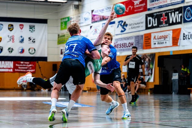 August 7, 2026, xdobgx, 2026 Heide Cup Handball Tournament, TSV Hannover Burgdorf vs. Mors Thy Handball; from left: Simon Skovhus Jensen (Mors Thy Handbold), 27; Leif Tissier (TSV Hannover Burgdorf), 7; on the ball; plays the ball; Silas Overby (Mors Thy Handbold), 36; one-on-one, duel, battle, tackle
