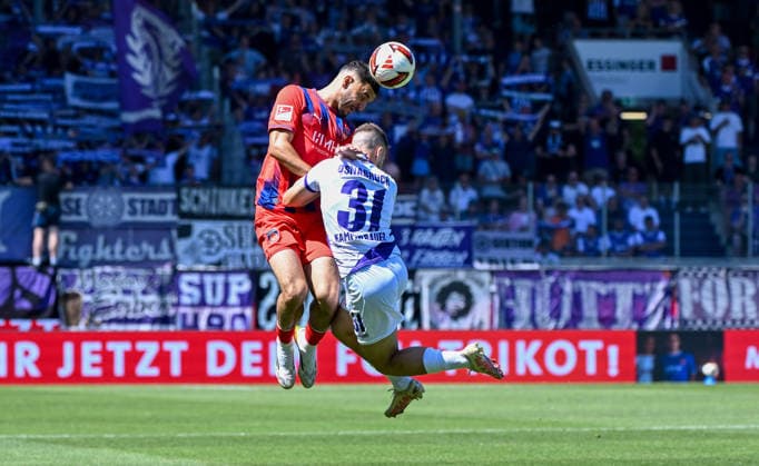 August 8, 2026, xemx, Soccer 2. Bundesliga, 1. FC Heidenheim vs. VfL Osnabrück, L. Oualid Mhamdi, 1. FC Heidenheim, Patrick Kammerbauer, VfL Osnabrück, tackle, action, battle for the ball. DFL and DFB regulations prohibit any use of photographs as image sequences and or quasi-video. Heidenheim