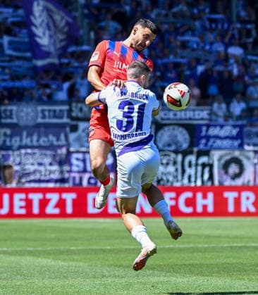 August 8, 2026, xemx, Soccer 2. Bundesliga, 1. FC Heidenheim vs. VfL Osnabrück, L. Oualid Mhamdi, 1. FC Heidenheim, Patrick Kammerbauer, VfL Osnabrück, tackle, action, battle for the ball. DFL and DFB regulations prohibit any use of photographs as image sequences and or quasi-video. Heidenheim