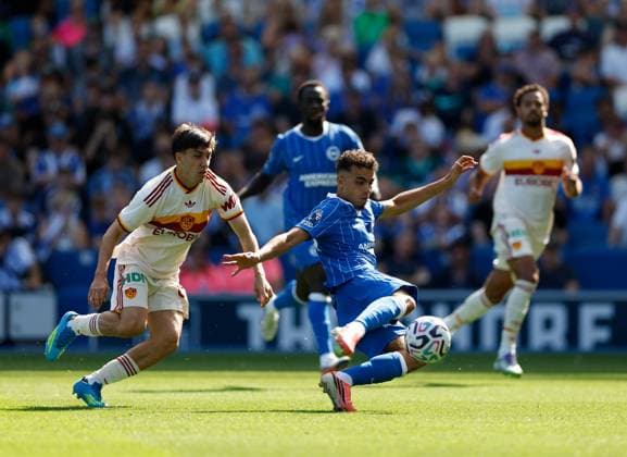 Yasin Ayari shoots to score the 3rd Brighton and Hove Albion goal watched by Mattia Mannini of AS Roma Brighton and Hove Albion v Roma, Pre Season Friendly, Football, American Express Community Stadium, Brighton, UK - 08 Aug 2026Brighton American Express Community Stadi United Kingdom EDITORIAL USE ONLY No use with unauthorised audio, video, data, fixture lists, club league logos or live services. Online in-match use limited to 120 images, no video emulation. No use in betting, games or single club league player publications. Copyright: xMattxImpey Shutterstockx 17050873l