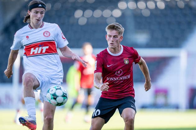 A tackle between Bennit Broger of Fortuna Köln, No. 38, and Lukas Stoppel of SG Sonnenhof Großaspach, No. 10; SG Sonnenhof Großaspach vs. Fortuna Köln, soccer, 3rd Division, Matchday 1, August 8, 2026, DFB regulations prohibit any use of photographs as image sequences and or quasi-video. Aspach, Baden-Württemberg, Germany Copyright: xkolbert-press PhilipxZieglerx