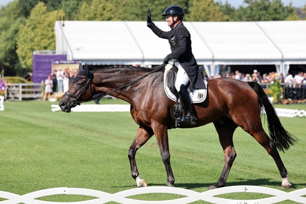 Cheers, excitement, waving, Michael Jung GER, Germany, with his horse fischerChipmunk FRH, Chipmunk FRH, dressage sub-test, eventing dressage, FEI Eventing World Championship, DHL Prize, Individual and Team, AACHEN FEI World Championships 2026, World Festival of Equestrian Sports, 2026 Equestrian World Championships, Aachen 2026, Welcome Home 2026, Aachen Soers, August 11–23, 2026, Equestrian Sports, August 14, 2026, Aachen Soers, Germany