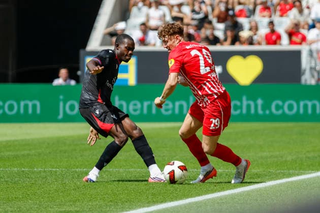Tyrick Mitchell of Crystal Palace, No. 03, and Philipp Treu of SC Freiburg, No. 29, in a tackle, Germany, soccer, friendly match, 2026–2027, SC Freiburg vs. Crystal Palace, August 15, 2026, Freiburg im Breisgau, Europa-Park Stadium, Germany Copyright: xGrantxHubbsx