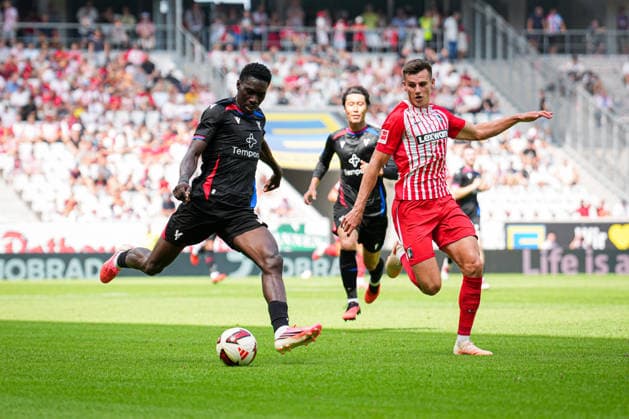 Germany, Soccer, Bundesliga 1, 2026–2027 Season, Friendly Match: SC Freiburg vs. Crystal Palace at Europa-Park Stadium, Freiburg; Ismaïla Sarr (Crystal Palace), 7 Yannik Engelhardt (SC Freiburg), 16 Freiburg, Europa-Park Stadium, Baden-Württemberg, Germany Copyright: xFINLEYxMÖRCHx