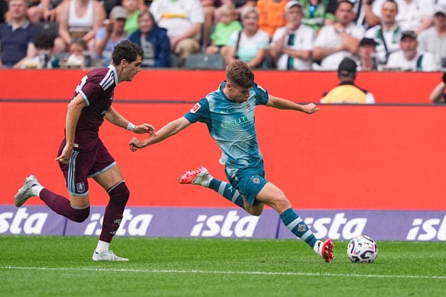 August 15, 2026, xydrx, Men s, Soccer, Season Opener, Borussia Mönchengladbach vs. Aston Villa, 2026–2027 season, ista Borussia Park, Kosta Nedeljkovic, Aston Villa, 32, in a tackle against Lukas Ullrich, Borussia Mönchengladbach, 26. DFB regulations prohibit any use of photographs as image sequences and or quasi-video. Copyright: HMBxMedia YannisxDreimann