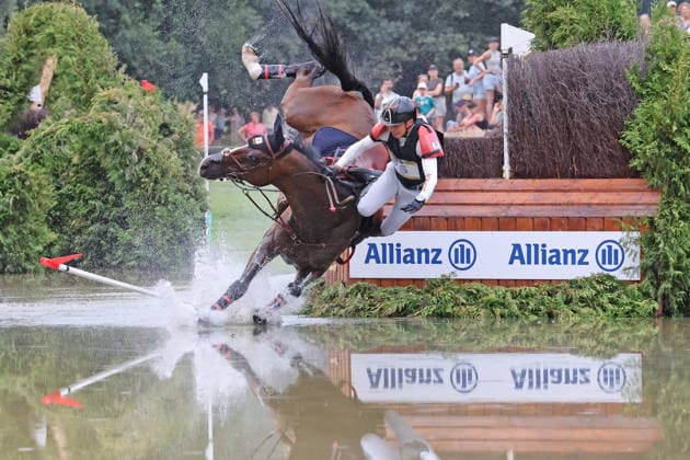 Toshiyuki Tanaka (JPN), Japan, riding Jefferson (JRA), falls at the Allianz Complex during the cross-country leg of the FEI Eventing World Championship, DHL Prize, Individual and Team Events, Cross-Country Test, Cross-Country, AACHEN FEI World Championships 2026, World Equestrian Festival, 2026 World Equestrian Championships, Aachen 2026, Welcome Home 2026, Aachen Soers, August 11–23, 2026, Equestrian Sports, August 15, 2026, Aachen Soers, Germany