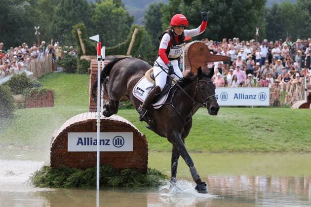 Katrin Khoddam Hazrati (AUT, Austria) and her horse Renegade are already celebrating and cheering after clearing the jump, Eventing Cross-Country, FEI Eventing World Championship, DHL Prize, Individual and Team, Cross-Country, Cross-Country, AACHEN FEI World Championships 2026, World Festival of Equestrian Sports, 2026 Equestrian World Championships, Aachen 2026, Welcome Home 2026, Aachen Soers, August 11–23, 2026, Equestrian Sports, August 15, 2026, Aachen Soers, Germany