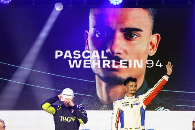 A disappointed Jake Dennis, second in Race 1 and the championship, alongside winner Pascal Wehrlein (GER, Porsche 94), smiling and leading the World Championship, on the podium, FIA Formula E World Championship, Season 12, London E-Prix, August 15, 2026, Excel Exhibition Center,