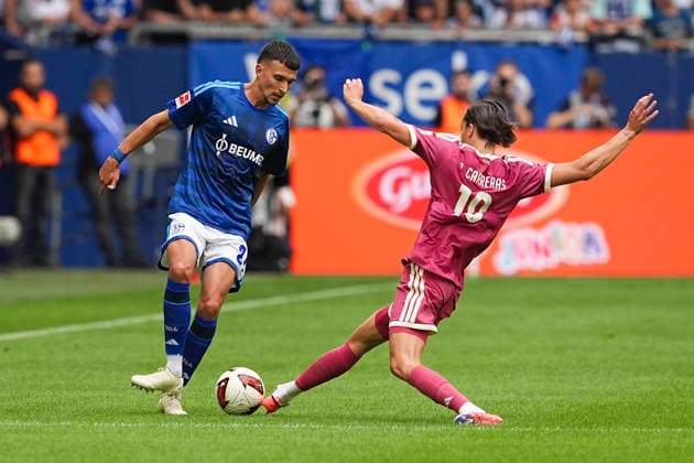August 16, 2026, xydrx, Men s, Soccer, Friendly Match, FC Schalke 04 vs. Real Madrid, 2026–2027 Season, Veltins Arena, Dejan Ljubicic (FC Schalke 04), No. 21 in a tackle against Alvaro Carreras (Real Madrid), No. 18. DFB regulations prohibit any use of photographs as image sequences and or quasi-video. Copyright: HMBxMedia YannisxDreimann