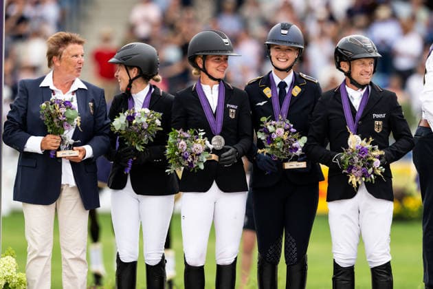 August 16, 2026: Team Germany—Malin Hansen Hotopp, Julia Krajewski, Libussa Lubbecke, and Michael Jung—celebrate on the podium after winning the team silver medal in the Eventing Show Jumping Final on Day 6 of the 2026 FEI World Championships on August 16, 2026 in Aachen. Photo: Emma Wallskog. BILDBYRAN code EW EW0687. equestrian sports, riding, 2026 World Championships, 2026 FEI World Championships, BBENG, equestrian sports, World Championships, eventing Copyright: EMMAxWALLSKOG BB260816EW058