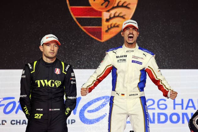 Jake Dennis (GBR) of Andretti, looking disappointed, alongside an emotional Pascal Wehrlein (GER) of Porsche, the world champion, at the world champions podium ceremony, Race 2, FIA Formula E World Championship, Season 12, London E-Prix, August 16, 2026, Excel Exhibition Center,