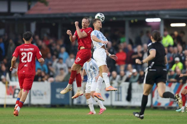 August 18, 2026, Men s Soccer, 2026–2027 Season, Bavarian Regional League, Matchday 5: TSV Aubstadt vs. TSV 1860 Munich—Marco Nickel (29), TSV Aubstadt, and Florian Niederlechner (7), TSV 1860 Munich in an aerial duel at Sulzfeld Schulstadion in Aubstadt, NGN Arena, Bavaria, Germany
