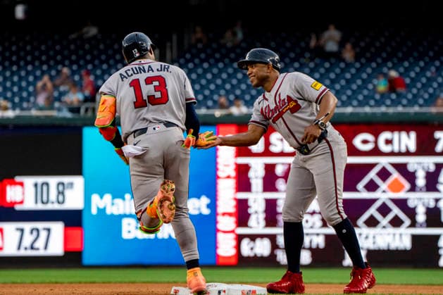 Atlanta Braves right fielder Ronald Acuna Jr. (13) high fives first base coach Antoan Richardson after hitting a home run in the top of the seventh inning during a game against the Washington Nationals at Nationals Park in Washington, DC on Wednesday, September 2, 2026. The Braves beat the Nationals 9-0. WAP20260902472 BONNIExCASH