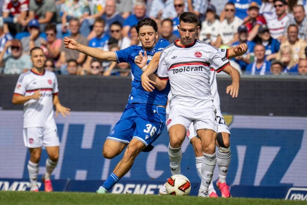 September 19, 2026, xdaymx, Soccer 2. Bundesliga, Karlsruher SC 1 FC Nürnberg, vl Pinto, Rafael Pedrosa, Karlsruher SC in a tackle with Alexios Kalegeropoulos, 1 FC Nürnberg, DFL, DFB. REGULATIONS PROHIBIT ANY USE OF PHOTOGRAPHS AS IMAGE SEQUENCES AND OR QUASI-VIDEO. Karlsruhe
