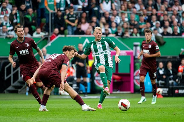 September 19, 2026, GER, Soccer, Men s, Bundesliga 1, 2026–2027 Season, Matchday 4, SV Werder Bremen vs. FC Augsburg Marco Grüll (Werder Bremen), No. 17, with the ball; in front of him, Yannik Keitel (FC Augsburg), No. 14. DFB and DFL regulations prohibit any use of photographs as image sequences and or quasi-video. Bremen Weserstadion, Bremen, Germany Copyright: xNordphoto Memmlerx