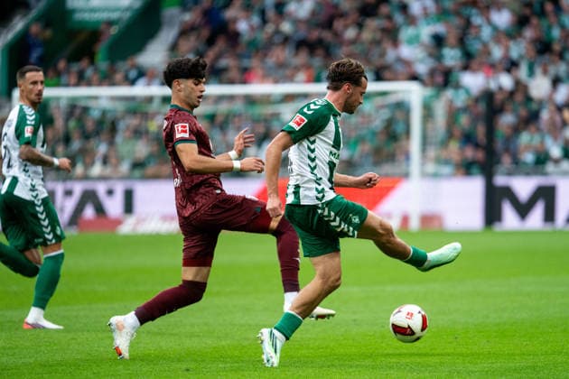 September 19, 2026, GER, Soccer, Men s, 1. Bundesliga, 2026–2027 Season, Matchday 4, SV Werder Bremen vs. FC Augsburg Olivier Deman (Werder Bremen, No. 02) in a tackle with Rodrigo Ribeiro (FC Augsburg, No. 09). DFB and DFL regulations prohibit any use of photographs as image sequences and or quasi-video. Weserstadion, Bremen, Germany Copyright: xNordphoto Memmlerx