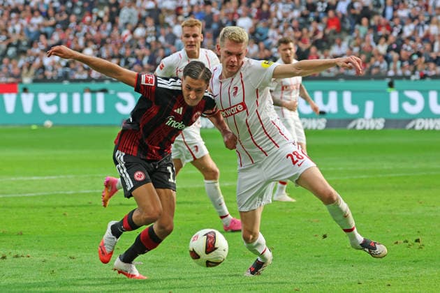 Younes Ebnoutalib, Eintracht Frankfurt, No. 11, in a tackle with Matthias Ginter, SC Freiburg, 28, Eintracht Frankfurt vs. SC Freiburg, Bundesliga, BL, 2026–2027 season, Match 4, September 19, 2026, Frankfurt, Deutsche Bank Park, Germany