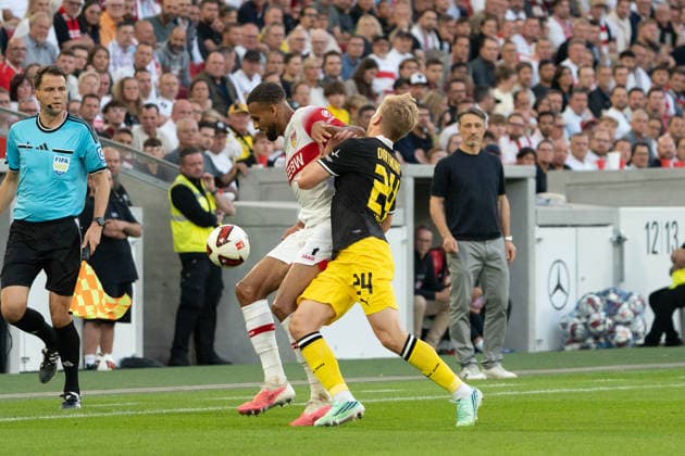 Tackle: Josha Vagnoman (VfB Stuttgart), 04, Daniel Svensson (Borussia Dortmund), 24, GER, VfB Stuttgart vs. Borussia Dortmund, Soccer, Bundesliga 1, Matchday 4, 2026–2027 season, September 19, 2026, DFL regulations prohibit any use of photographs as image sequences and or quasi-video, GER, VfB Stuttgart vs. Borussia Dortmund, soccer, Bundesliga 1, Matchday 4, 2026–2027 season, September 19, 2026, Stuttgart Copyright: xEibner-Pressefoto EdwardxCheungx EP_ECG