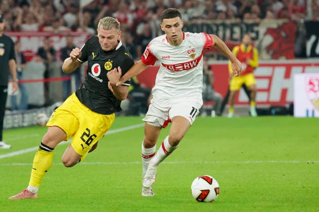 Pictured from left: Julian Ryerson of Borussia Dortmund, No. 26, in a tackle against Bilal El Khannouss of VfB Stuttgart, No. 11, September 19, 2026, VfB Stuttgart vs. Borussia Dortmund, Bundesliga 1, Matchday 4, Germany, Stuttgart, MHP Arena; DFL regulations prohibit any use of photographs as image sequences and or quasi-video Copyright: HMBxMedia xJulienxBecker