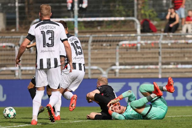 September 19, 2026, xsefx, Soccer, FC Viktoria Köln vs. FC Ingolstadt 04, 3rd Division, Sportpark Höhenberg, Matchday 7, 2026–2027 Season: Goalkeeper David Klein (FC Ingolstadt 04, 47) lies on the ground with a pained expression. DFB regulations prohibit any use of photographs as image sequences and or quasi-video. North Rhine-Westphalia, Germany