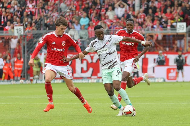 September 20, 2026, xtgx, Soccer 2. Bundesliga, FC Energie Cottbus vs. FC St. Pauli, from left: Luca Erlein (Cottbus), 21, Abdoulie Ceesay (St. Pauli), 9: Tackle, duel, battle, DFL and DFB regulations prohibit any use of photographs as image sequences and or quasi-video. Cottbus