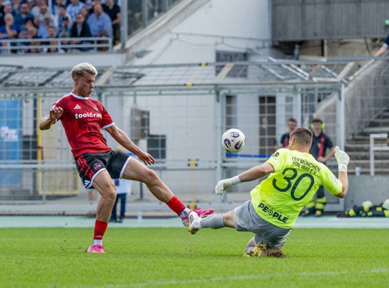 Vitus Eicher, goalkeeper for TSV 1860 Munich (30), stops a scoring chance by Levin Chiumento of 1. FC Nuremberg II U23 (09 GER), TSV 1860 Munich vs. 1. FC Nuremberg II U23, Soccer, Bavarian Regional League, Matchday 10, 2026–2027 Season, September 20, 2026 DFL and DFB regulations prohibit any use of photographs as image sequences and or quasi-video. Photo: HMB Media, Heike Feiner Copyright: HMBxMedia HeikexFeiner