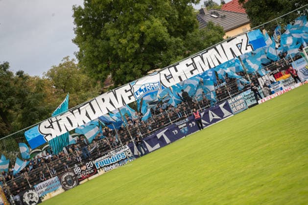 Soccer, Northeast Regional League, BSG Chemie Leipzig vs. Chemnitzer FC, September 20, 2026, Chemnitz—fan section with a banner in the south curve and many flags; fans, atmosphere, soccer, Northeast Regional League, 2026–2027 season, Matchday 10: BSG Chemie Leipzig vs. Chemnitzer FC on September 20, 2026, at the Alfred Kunze Sportpark, Leipzig Leutzsch Copyright: xBEAUTIFULxSPORTS JanxKaeferx