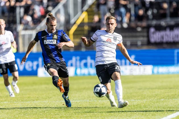 SSV Ulm 1846 Soccer vs. SV Eintracht Trier, Soccer, Regionalliga Southwest, Matchday 9, Donaustadion Ulm, September 26, 2026; Cropped single frame, from left: Sinan Tekerci (SV Eintracht Trier), 22, Alexander Kopf, SSV Ulm 1846 soccer, 20 SSV Ulm 1846 soccer vs. SV Eintracht Trier, soccer, Regionalliga Southwest, Matchday 9, Donaustadion Ulm, September 26, 2026; Photo by Lucca Fundel, Ulm Donaustadion, Baden-Württemberg, Germany