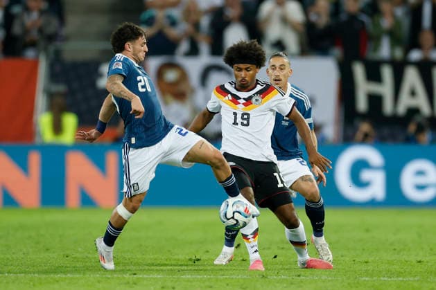 From left to right: Christos Zafeiris (Greece), Karim Adeyemi (Germany), and Kostas Tsimikas (Greece), in action during the UEFA Nations League match between Germany and Greece at the WWK Arena in Augsburg, Germany, on September 27, 2026, Augsburg, Germany, on September 27, 2026 Copyright: HMBxMedia xHeikoxBecker