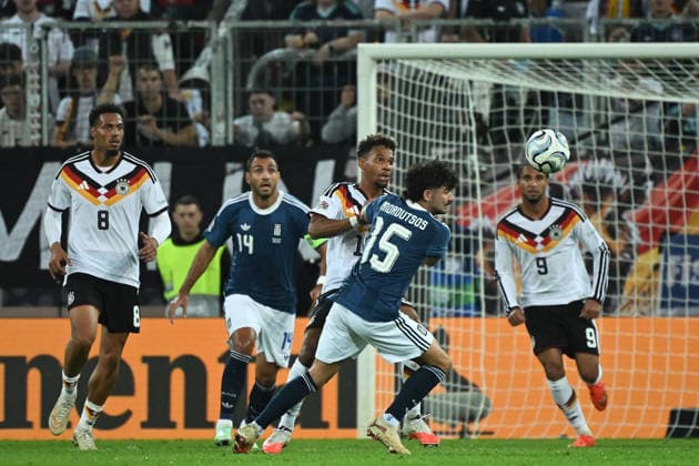 September 27, 2026, xemx, Soccer UEFA Nations League, Germany vs. Greece, Bambase Conte, German National Soccer Team (DFB), Thanasis Androutsos, Greece, tackle, action, battle for the ball, Augsburg