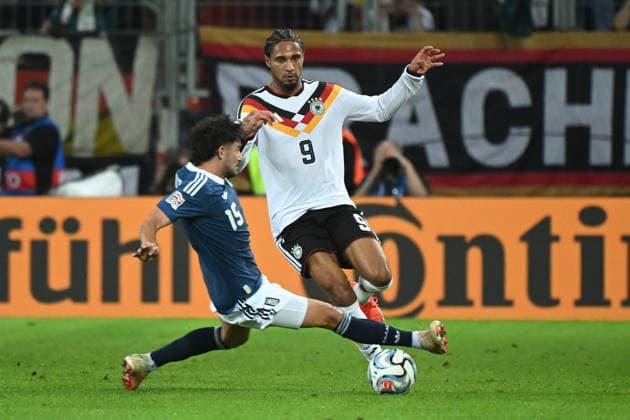 September 27, 2026, xemx, Soccer UEFA Nations League, Germany vs. Greece, Thanasis Androutsos (Greece) vs. Kevin Schade (German National Soccer Team, DFB), tackle, action, battle for the ball, Augsburg