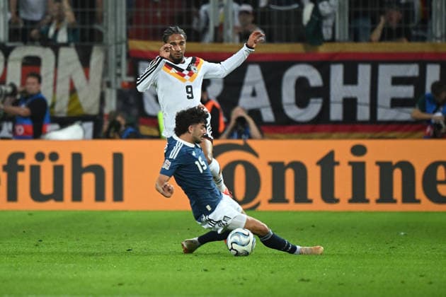 September 27, 2026, xemx, Soccer UEFA Nations League, Germany vs. Greece, Thanasis Androutsos (Greece) vs. Kevin Schade (German National Soccer Team, DFB), tackle, action, battle for the ball, Augsburg