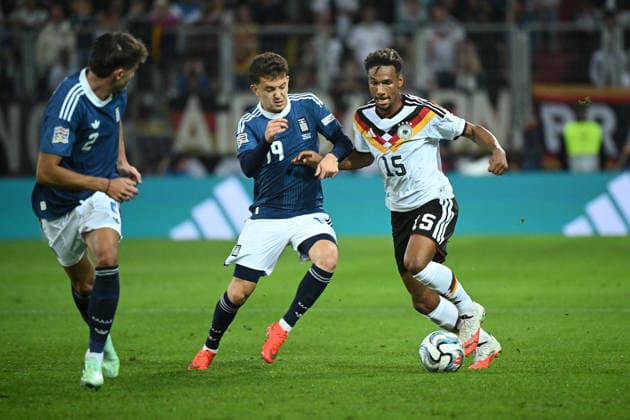 September 27, 2026, xemx, Soccer, UEFA Nations League, Germany vs. Greece, Konstantinos Karetsas, Greece, Bambase Conte, German National Soccer Team (DFB), tackle, action, battle for the ball, Augsburg