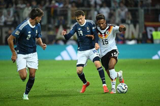 September 27, 2026, xemx, Soccer, UEFA Nations League, Germany vs. Greece, Konstantinos Karetsas, Greece, Bambase Conte, German National Soccer Team (DFB), tackle, action, battle for the ball, Augsburg