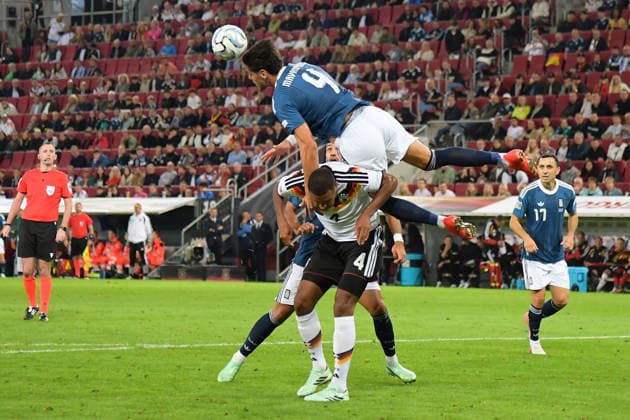 September 27, 2026, xemx, Soccer, UEFA Nations League, Germany vs. Greece, Jonathan Tah, German National Soccer Team (DFB), Konstantinos Ntinos Mavropanos, Greece, tackle, action, battle for the ball, Augsburg