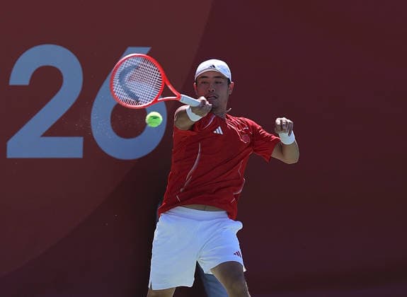 (261001) -- NAGOYA, Oct. 1, 2026 -- Wu Yibing of China competes during the men s singles quarterfinals of tennis against Sumit Nagal of India at the 20th Asian Games Aichi-Nagoya 2026 in Nagoya, Japan, Oct. 1, 2026. ) (SP)JAPAN-NAGOYA-ASIAN GAMES-TENNIS-MEN S SINGLES LixBo