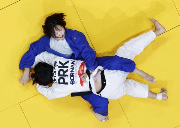 Aichi-Nagoya Asian Games: Judo Japan s Narumi Tanioka (blue) competes against Kim Ji Hye of North Korea in the Aichi-Nagoya Asian Games women s judo 63-kilogram final at Aichi International Arena in Nagoya, central Japan, on Oct. 1, 2026. A14AA0005629635P