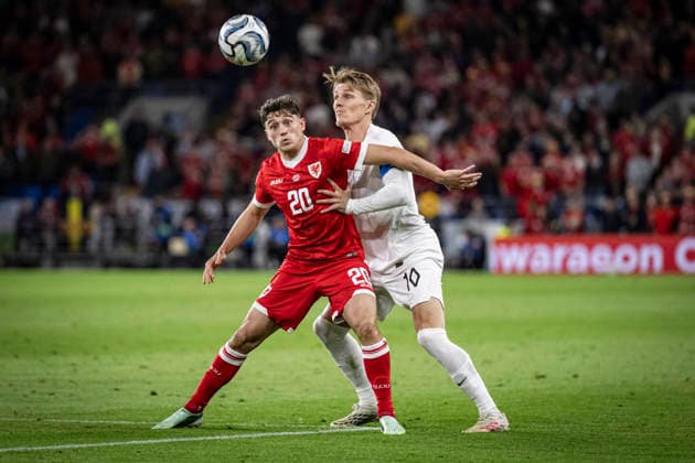 RECORD DATE NOT STATED 1st October 2026; Cardiff City Stadium, Cardiff, Wales; UEFA Nations League Football, Wales versus Norway; Daniel James of Wales holds off Martin Odegaard of Norway GodfreyxPitt