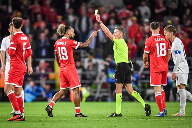 RECORD DATE NOT STATED 1st October 2026; Cardiff City Stadium, Cardiff, Wales; UEFA Nations League Football, Wales versus Norway; Referee Alejandro Hernandez (ESP) issues a yellow card to Sorba Thomas of Wales GodfreyxPitt