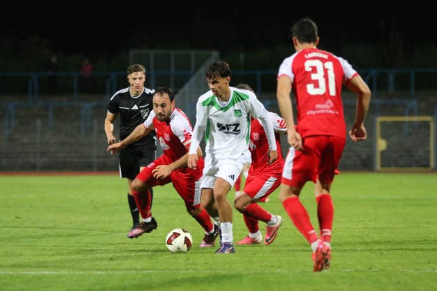 October 2, 2026 Men s Soccer 2026–2027 dachbleche24 State Cup, 2nd Round: SG Reppichau vs. Hallescher FC at Paul Greifzu Stadium, Dessau-Roßlau, Franz Lange, Reppichau, 21, white, is being marked by Robert Berger, Halle, 2, red, Dessau-Roßlau, Saxony-Anhalt, Germany