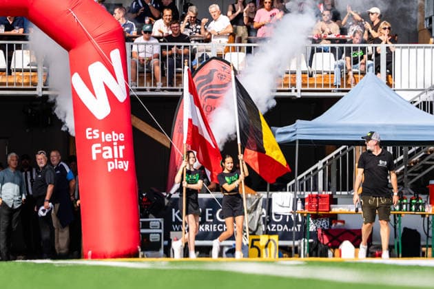 AMERICAN FOOTBALL - IFAF EC, AUT vs BEL SALZBURG,AUSTRIA,04.OCT.26 - AMERICAN FOOTBALL - IFAF European Championship, EM, Europameisterschaft Austria vs Belgium. Image shows girls with flags. GEPAxpictures xJulioxArellano