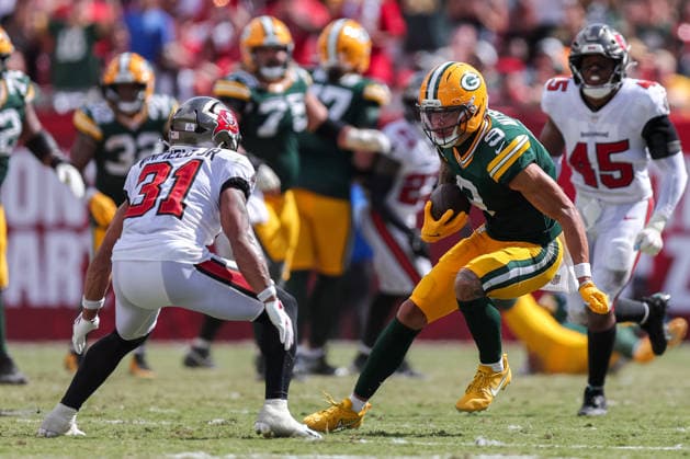 Oct 4, 2026; Tampa, FL, USA; Green Bay Packers wide receiver Christian Watson (9) attempts to avoid a tackle by Tampa Bay Buccaneers safety Antoine Winfield Jr. (31) after catching a pass during the NFL, American Football Herren, USA game between the Green Bay Packers and Tampa Bay Buccaneers at Raymond James Stadium. Mandatory Credit: Taylor McFee-Cal Media NFL 2026: Packers Vs Buccaneers OCT 04 - ZUMAc04_ 20261004_zma_c04_088 Copyright: xTaylorxMcfeex