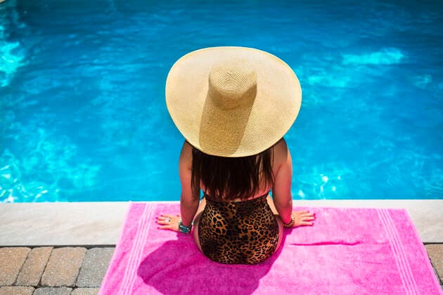Rear view of young woman in sunhat sitting at poolside, 28.08.2014, Copyright: xStevexPrezantx, model released, wearing,black hair,pink,turquoise,copy space,high angle view,leopard skin,rear view,waist up,feminine,contented,happiness,relaxation,beach towel,20 to 24 years,caucasian ethnicity,female,woman,young woman,only one young woman,one person,outdoors,summer,day,swimming pool,poolside,sun hat,swimwear,swimming costume,sitting,long hair,lifestyle,sunlight,water,leisure,vacation,only female,September 2014 Release,Sitting,Caucasian Ethnicity,Young Adult,20-24 Years,Female,Women,Young Women,Young Adult Woman,Femininity,Relaxation,Satisfaction,Wellbeing,Happiness,Blue,Turquoise,Pink,Long Hair,One Person,Copy Space,Waist Up,High Angle View Ref:IS09AK7XY