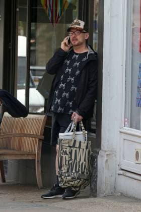 EXCLUSIVE: A dressed down Boy George was spotted having an animated chat on his mobile phone at Starbucks in Hampstead 138100, EXCLUSIVE: A dressed down Boy George was spotted having an animated chat on his mobile phone at Starbucks in Hampstead. The Culture Club singer, wearing a Whatever hand gesture printed shirt, recently revealed that Grammy winning singer Sam Smith was his new neighbor. London, United Kingdom - Tuesday June 2, 2015. UK, FRANCE, GERMANY, ITALY, MAILONLINE OUT, Credit:PacificCoastNews Avalon United Kingdom, London Copyright: xPacificCoastNewsx xAvalonx 0519425581