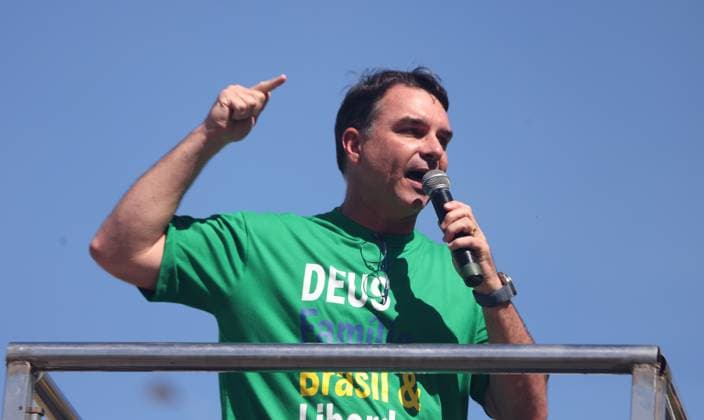 August 3, 2025, Rio De Janeiro, Rio De Janeiro, Brazil: FLAVIO BOLSONARO speaks to thousands of supporters of former Brazil President Jair Bolsonaro who gathered Sunday morning on Rioâ€⠢s Copacabana waterfront for the ‘Reaja, Brasilâ€⠢ (React, Brazil) protest, denouncing political persecution ahead of his upcoming coup attempt trial. Bolsonaro, under court-ordered restrictions, did not appear but phone into his son during the rally. The demonstration aims to regroup his hard-core base amid turbulence, including backlash to sanctions on Donald Trump, Lulaâ€⠢s rising popularity, and Bolsonaroâ€⠢s recent legal defeats. Rio De Janeiro Brazil - ZUMAk251 20250803_znp_k251_025 Copyright: xBobxKarpx